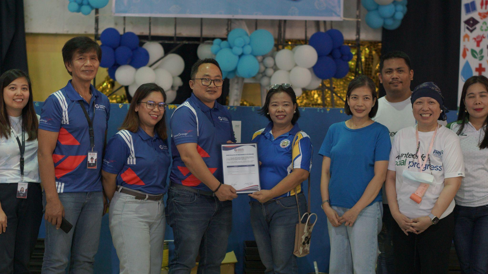 LausGroup presenting the Certificate of Insurance Coverage during the Ready for School 2026 (RFS 2026) program.